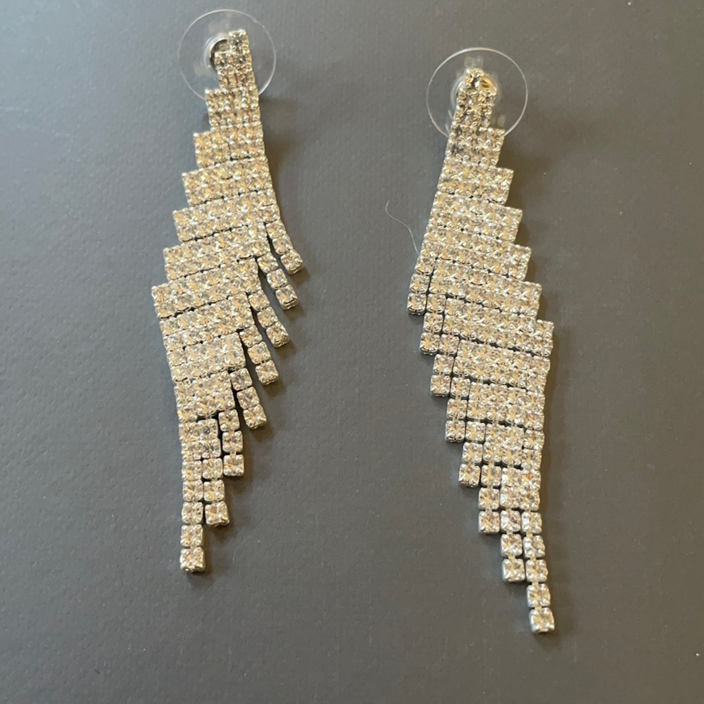 Rhinestone earrings layered on silver plated mesh